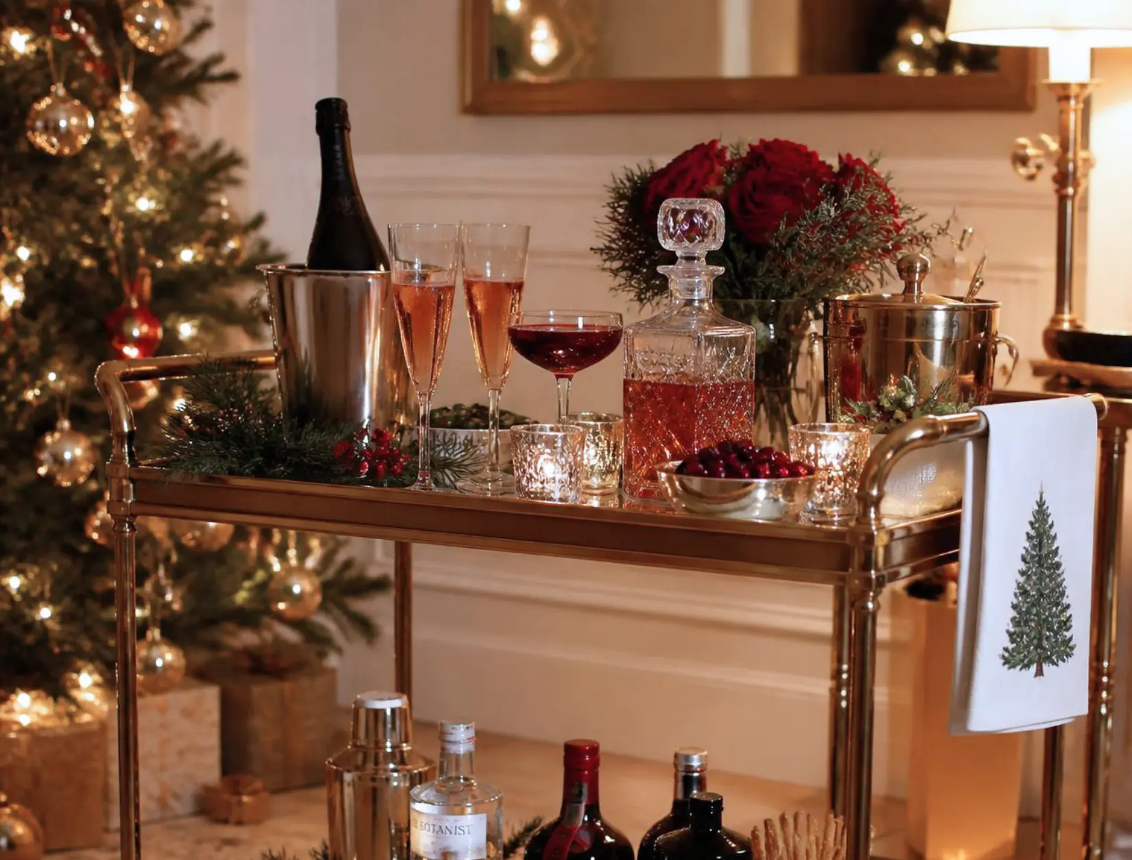 Festive holiday bar cart with garland and sparkling cocktails by candlelight